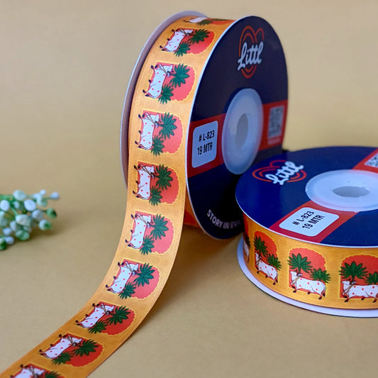 Two spools of ribbon with a festive design on a beige background