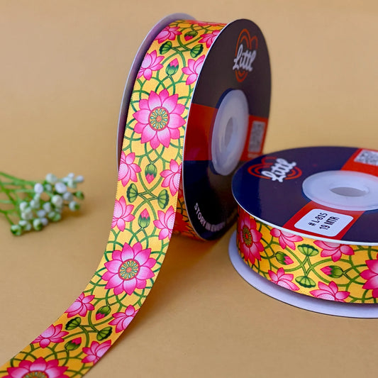 Two spools of floral ribbon with a yellow background