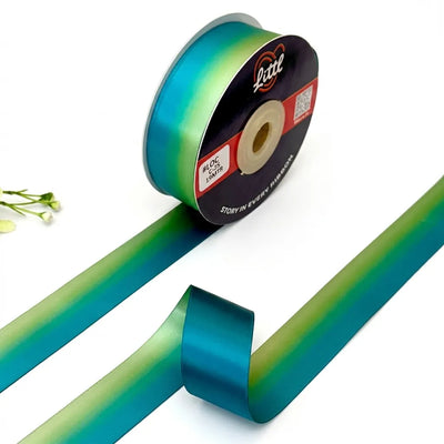 The Peacock Fade ombre satin ribbon Peacock Teal to Sage Green gradient 25mm gifting ribbon for heritage and export gifting by Littl