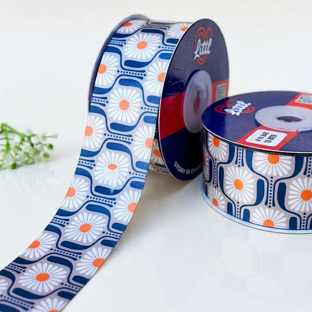 Daisy Tile Retro printed satin ribbon roll, white daisies with orange centres in navy tiles on grey with a white back, 1.5 inch (38 mm) – Littl