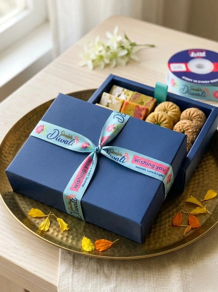 Navy Diwali sweet box tied with a printed Diwali satin ribbon from Littl