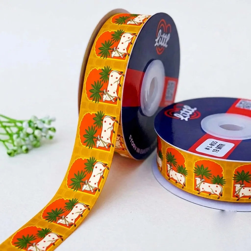Gau Mata Folk Pichrang printed satin ribbon roll, Pichwai cows under palm trees on orange and yellow with a white back, 1 inch (25 mm) – Littl