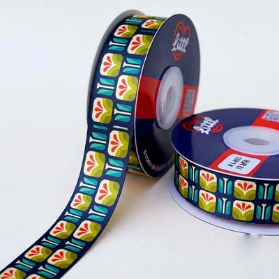 Tulip Tile Retro printed satin ribbon roll, cream tulips with red and teal petals in tiles on navy blue with a white back, 1 inch (25 mm) – Littl