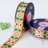 Mod Petal Retro printed satin ribbon roll, pink, orange and teal petal flowers in a geometric grid on cream with a white back, 1 inch (25 mm) – Littl