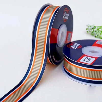 Regatta Stripe Retro printed satin ribbon roll, a grey pinstripe band edged in navy, cream and orange with a white back, 1 inch (25 mm) – Littl