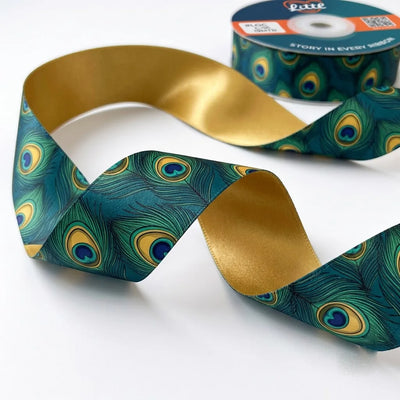 Close-up of Peacock Plume ribbon: jewel peacock feathers in teal, green and gold printed on deep violet satin