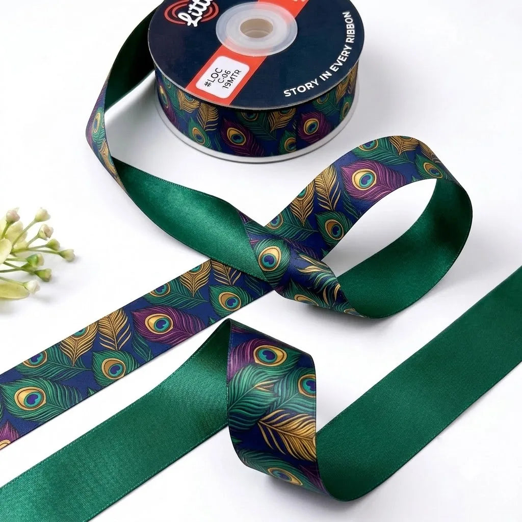 Peacock Plume ribbon twisted to show the printed front and solid emerald green back