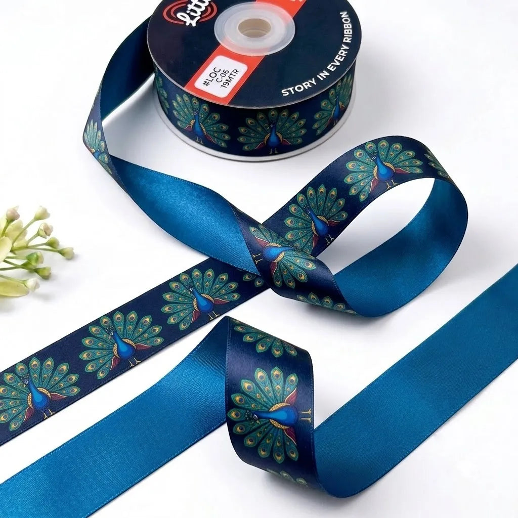 Dancing Peacock ribbon twisted to show the printed front and solid peacock blue back