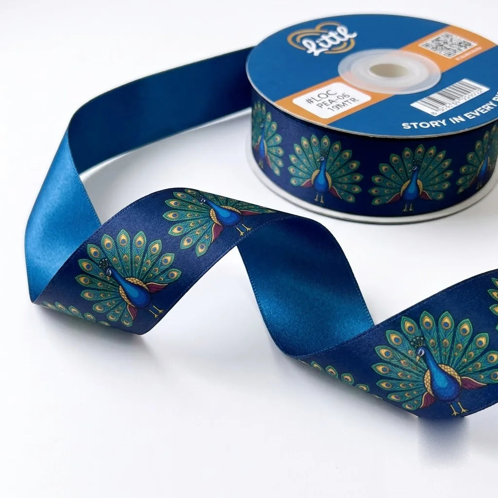 Close-up of Dancing Peacock ribbon: peacocks with open tails printed on navy blue satin
