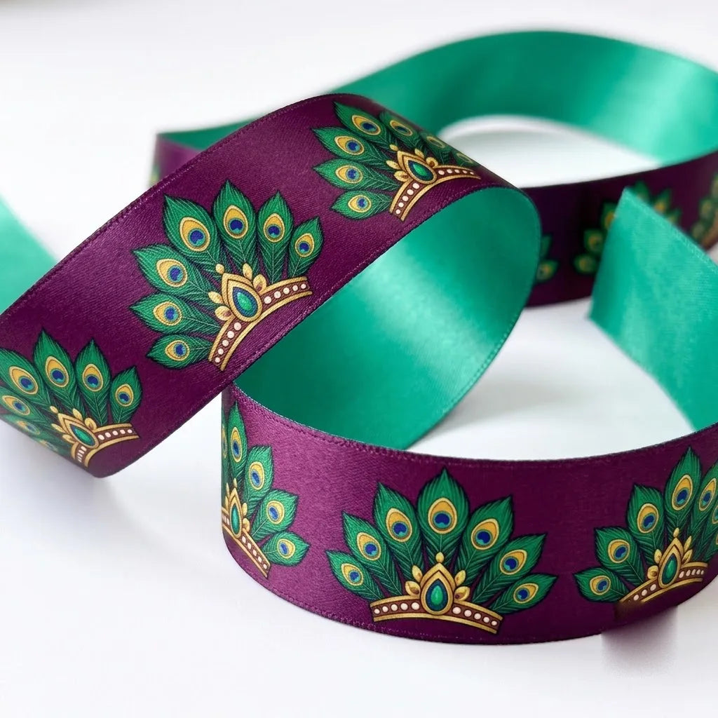Close-up of Peacock Fan ribbon: emerald peacock fans with gold printed on plum purple satin