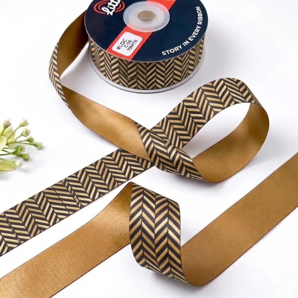 Gold Herringbone ribbon twisted to show the printed front and solid antique gold back