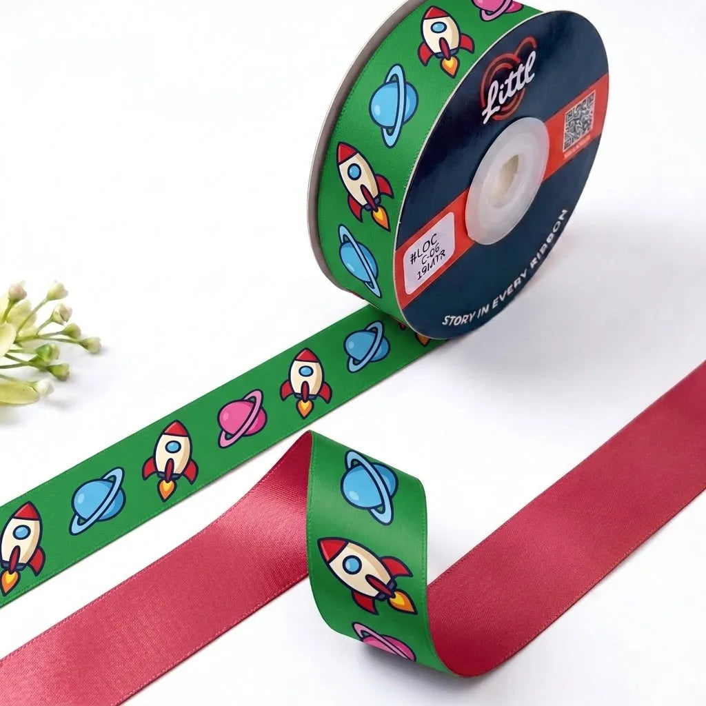 Rocket Ride Kids printed satin ribbon roll, rockets and planets on grass green with a solid cherry red back, 1 inch (25 mm) – Littl
