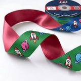 Close-up of Rocket Ride ribbon: rockets and planets printed on grass green satin
