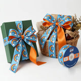 Gift wrapped with Rainbow Clouds Kids printed ribbon from Littl
