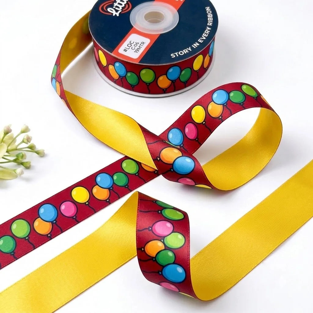 Balloon Party ribbon twisted to show the printed front and solid sunny yellow back