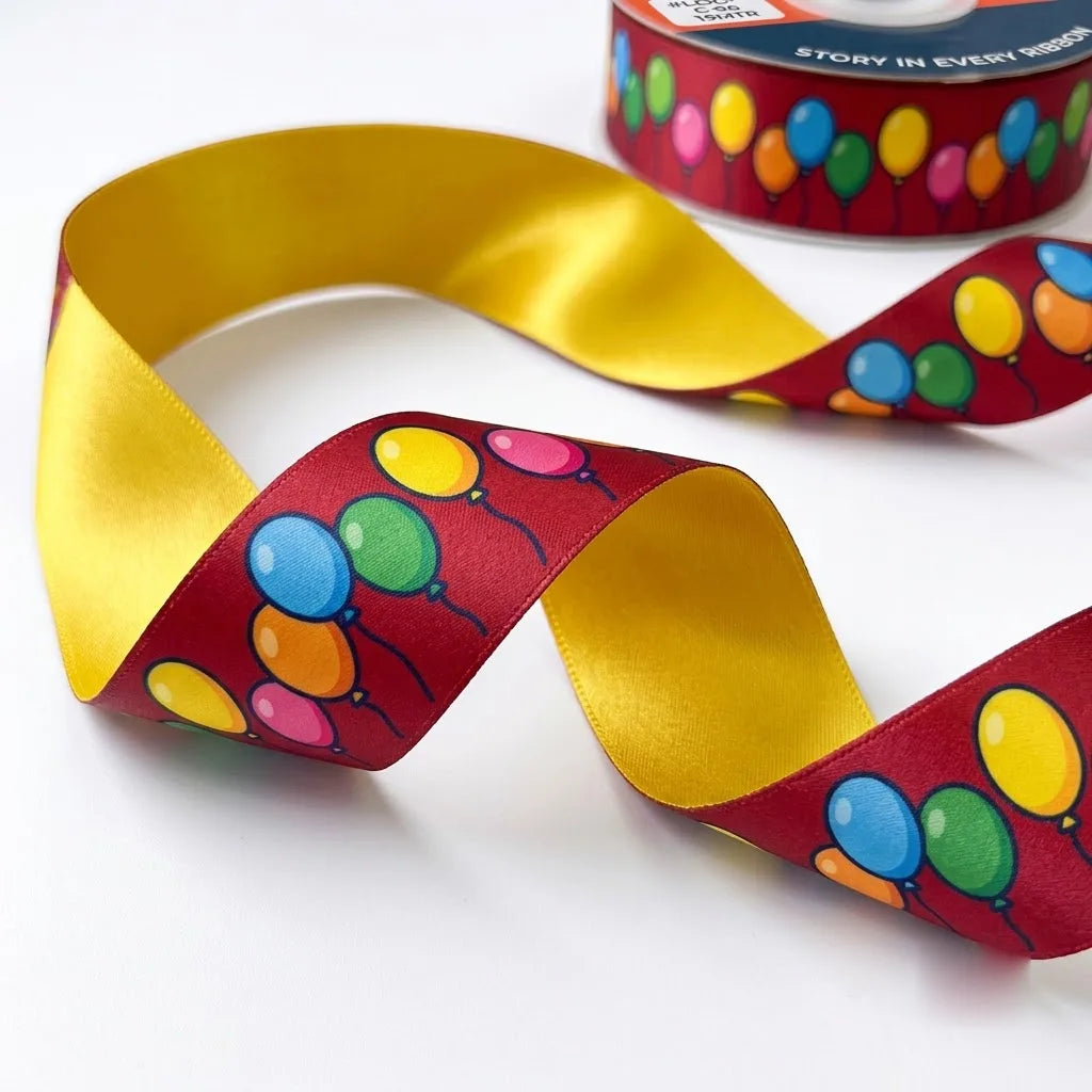 Close-up of Balloon Party ribbon: bunches of colourful balloons printed on maroon satin