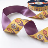 Close-up of Tulip & Daisy ribbon: tulips and daisies printed on mustard yellow satin