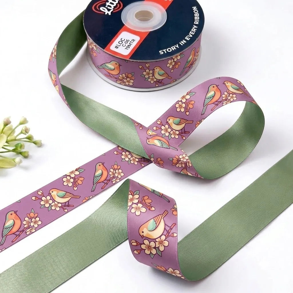 Songbird Blossom ribbon twisted to show the printed front and solid sage green back