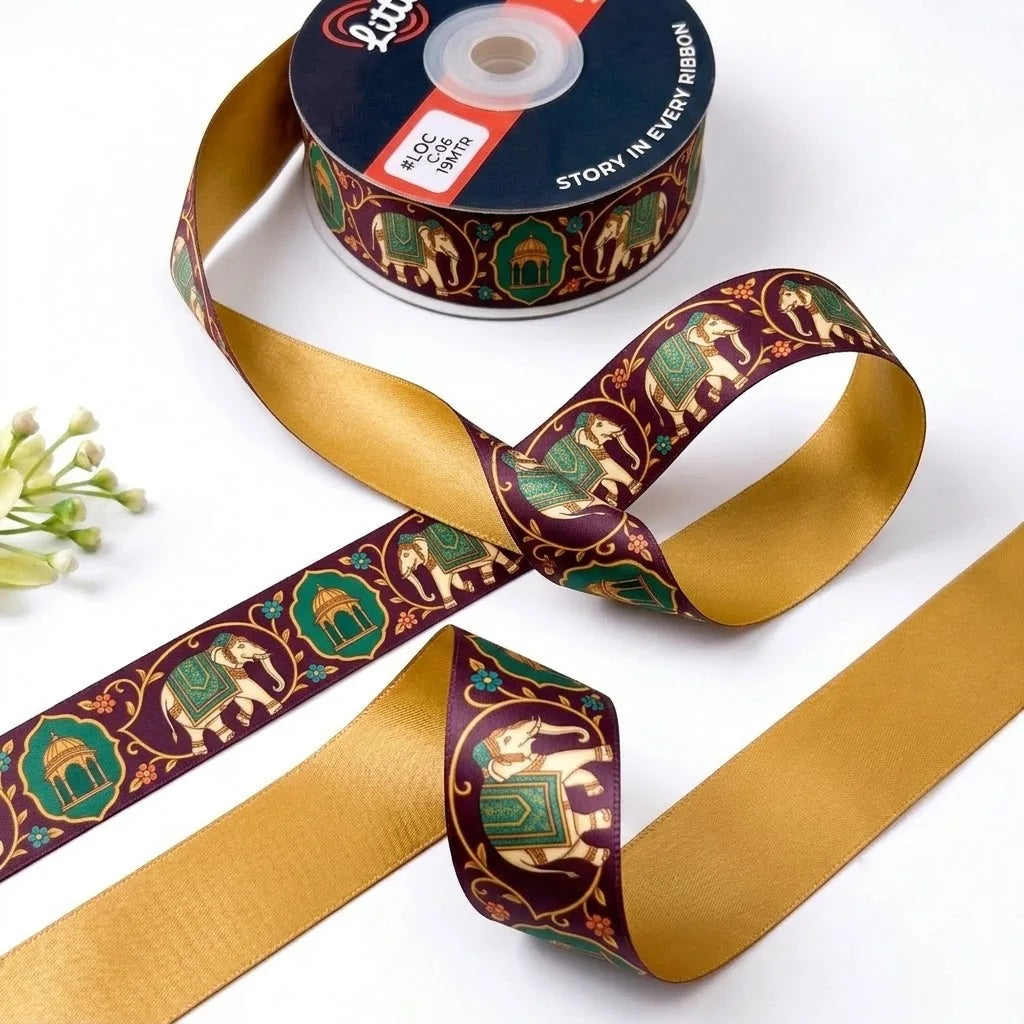 Elephant Darbar ribbon twisted to show the printed front and solid mustard gold back