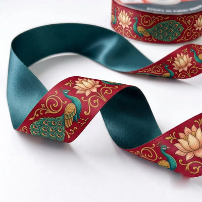 Close-up of Peacock Lotus ribbon: a peacock among lotus blooms printed on maroon satin