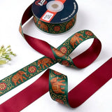 Elephant Mela ribbon twisted to show the printed front and solid crimson red back