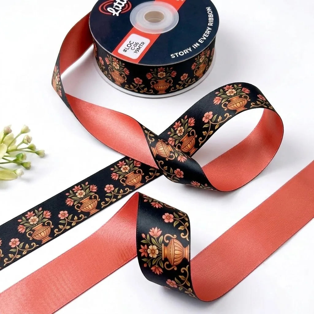 Kalash Bloom ribbon twisted to show the printed front and solid coral back