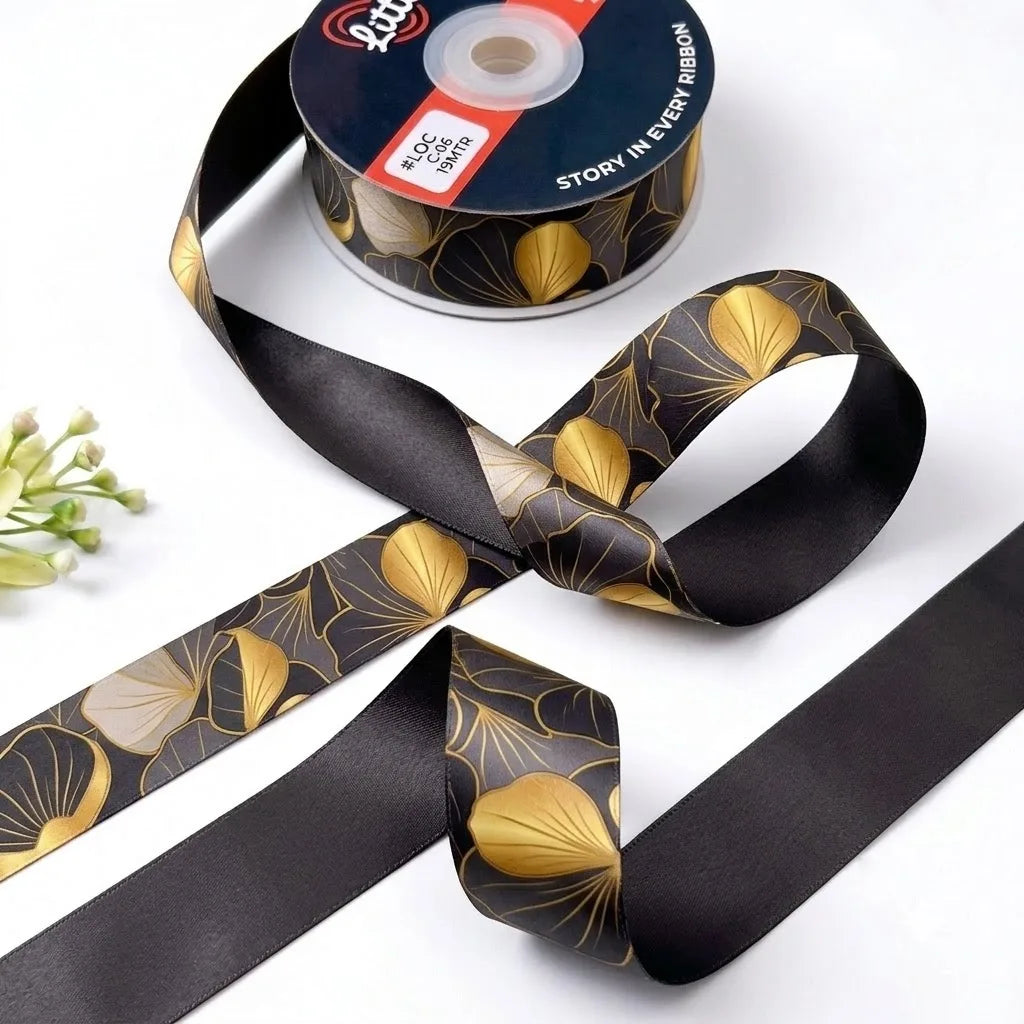 Ginkgo Noir ribbon twisted to show the printed front and solid black back
