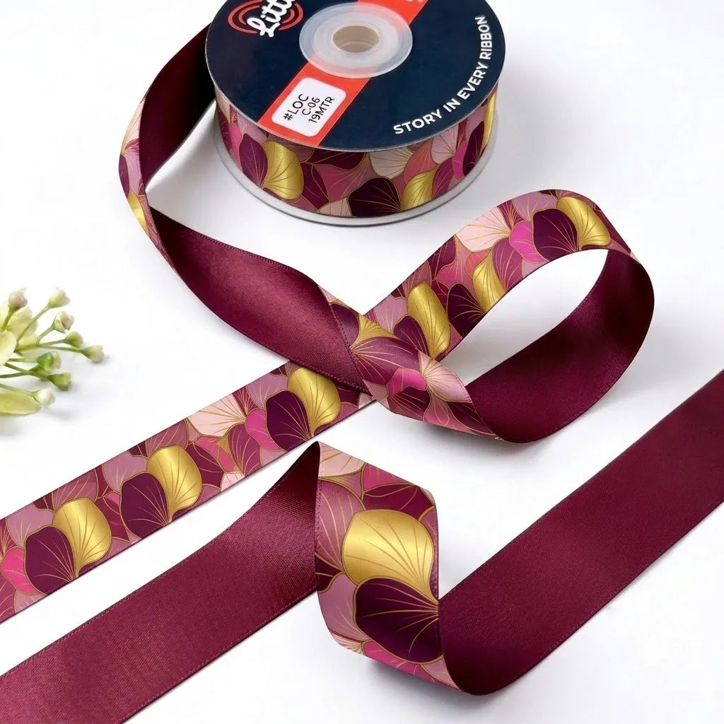 Ginkgo Rose ribbon twisted to show the printed front and solid wine back