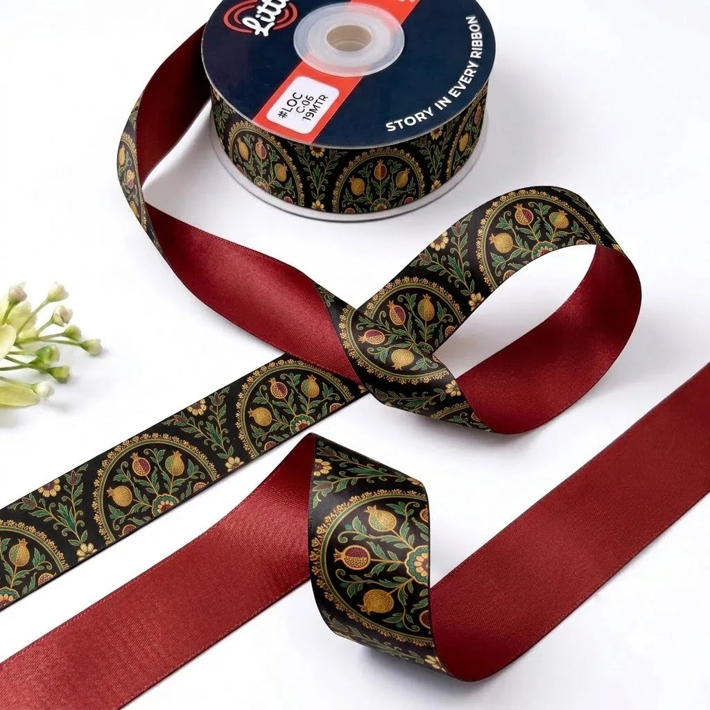 Paisley Jaal ribbon twisted to show the printed front and solid maroon back