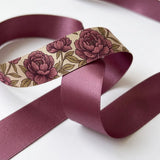 Close-up of Cabbage Rose ribbon: plum cabbage roses printed on cream satin