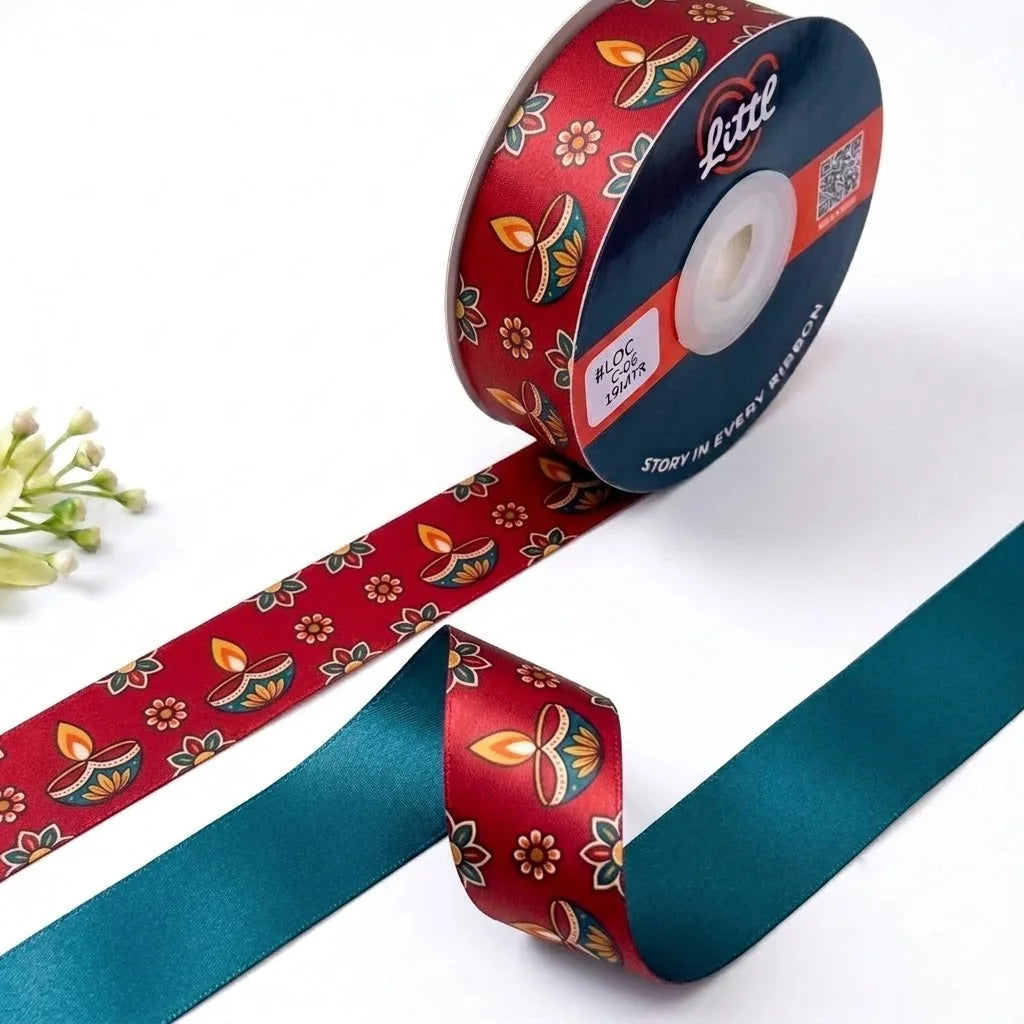 Diya Glow Diwali printed satin ribbon roll, glowing diyas and flowers on festive red with a solid teal back, 1 inch (25 mm) – Littl