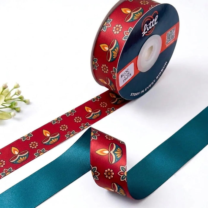 Diya Glow Diwali printed satin ribbon roll, glowing diyas and flowers on festive red with a solid teal back, 1 inch (25 mm) – Littl