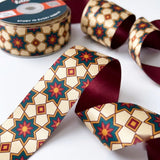 Close-up of Kandil Star ribbon: eight-point kandil star lanterns printed on cream satin