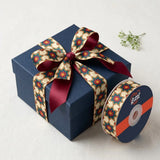 Gift wrapped with Kandil Star Diwali printed ribbon from Littl