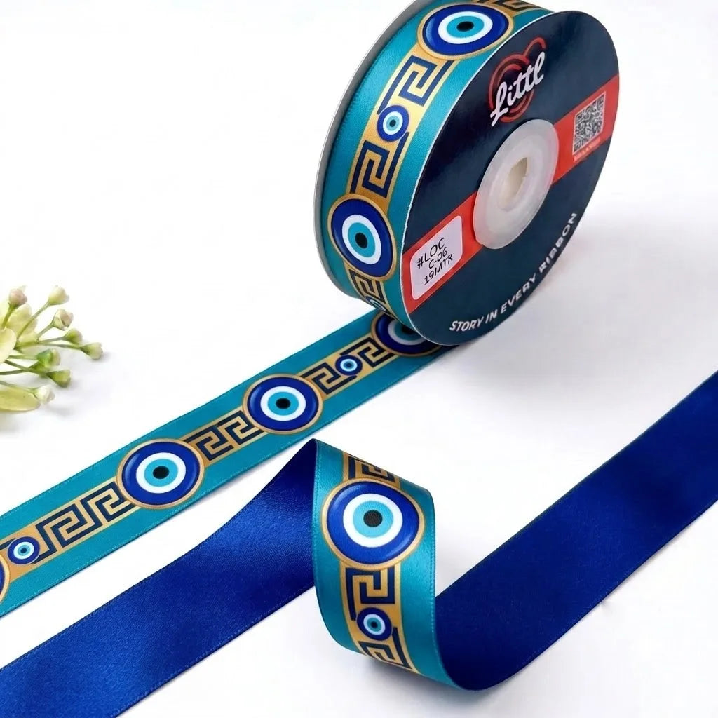 Nazar Key Evil Eye printed satin ribbon roll, evil eyes along a gold Greek key band on teal with a solid royal blue back, 1 inch (25 mm) – Littl