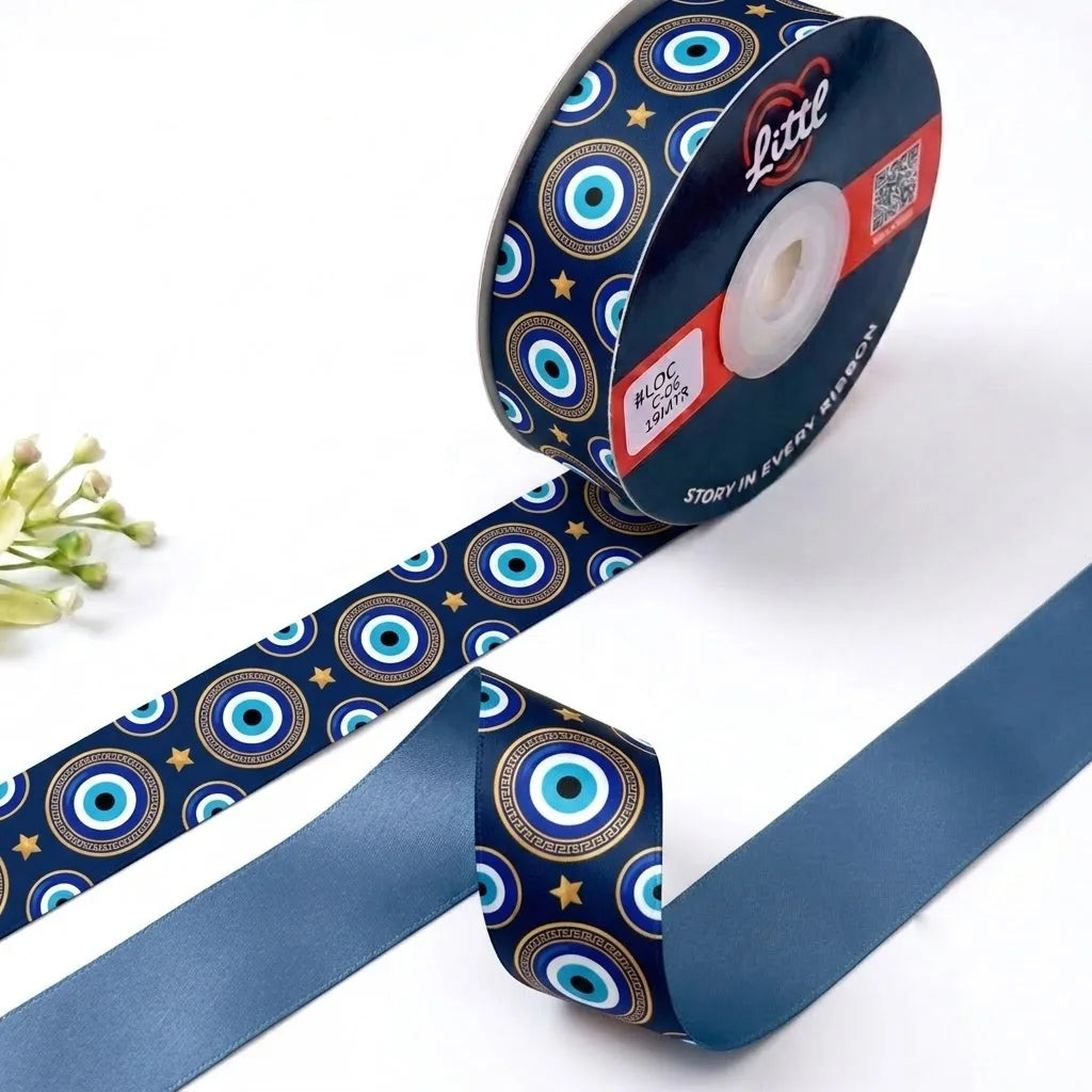 Nazar Night Evil Eye printed satin ribbon roll, evil eyes and gold stars on navy blue with a solid slate blue back, 1 inch (25 mm) – Littl
