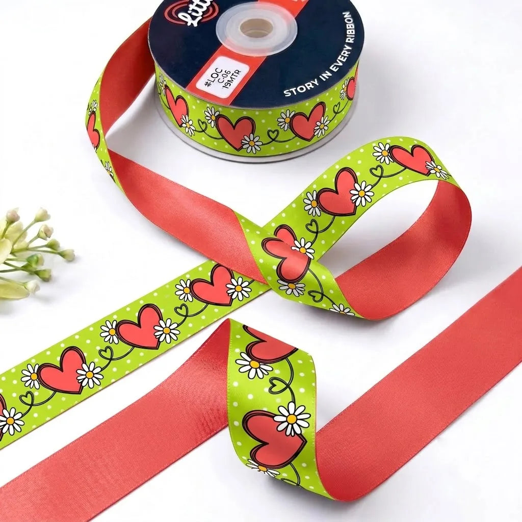 Heart Vine ribbon twisted to show the printed front and solid coral red back